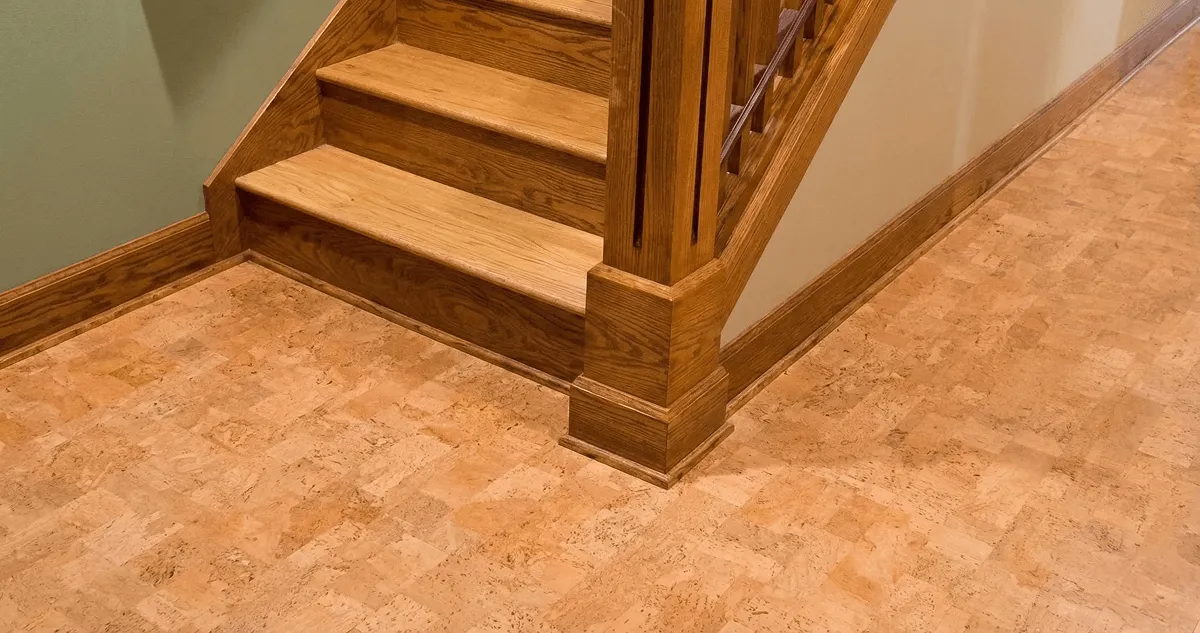 End of a staircase with cork flooring in Lowell, MA